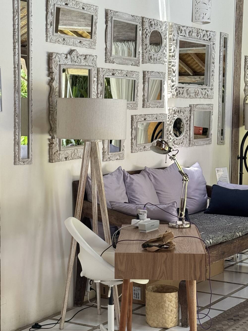 Desk corner by the carved mirror wall and daybed, villa in Bali