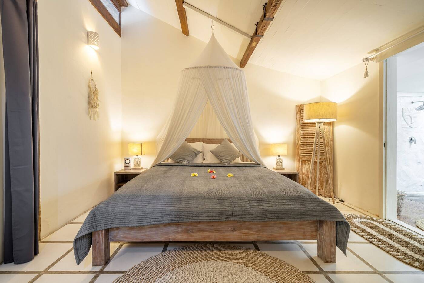 First bedroom with king bed, mosquito net and en-suite bathroom, Villa Desa Naga 1, Canggu, Bali