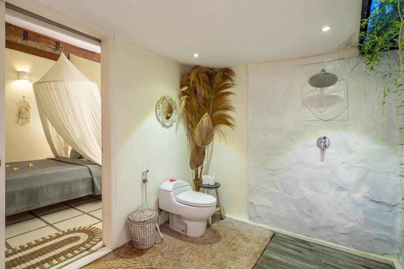 Bathroom of the first bedroom with rain shower and stone wall, Berawa, Bali