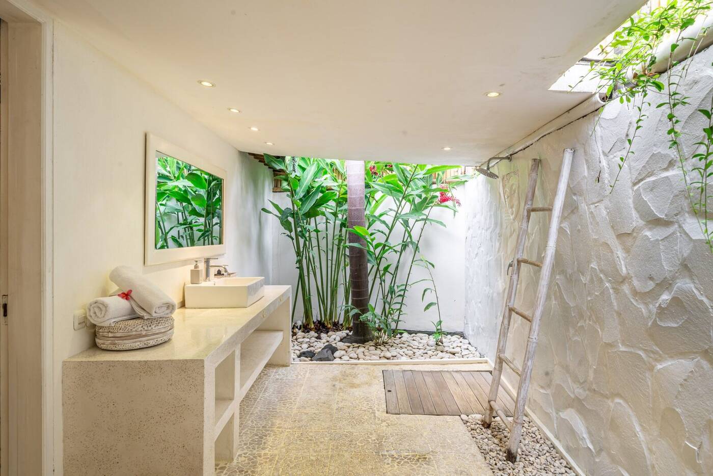 Open-air bathroom with stone basin and garden, Villa Desa Naga 1, Bali