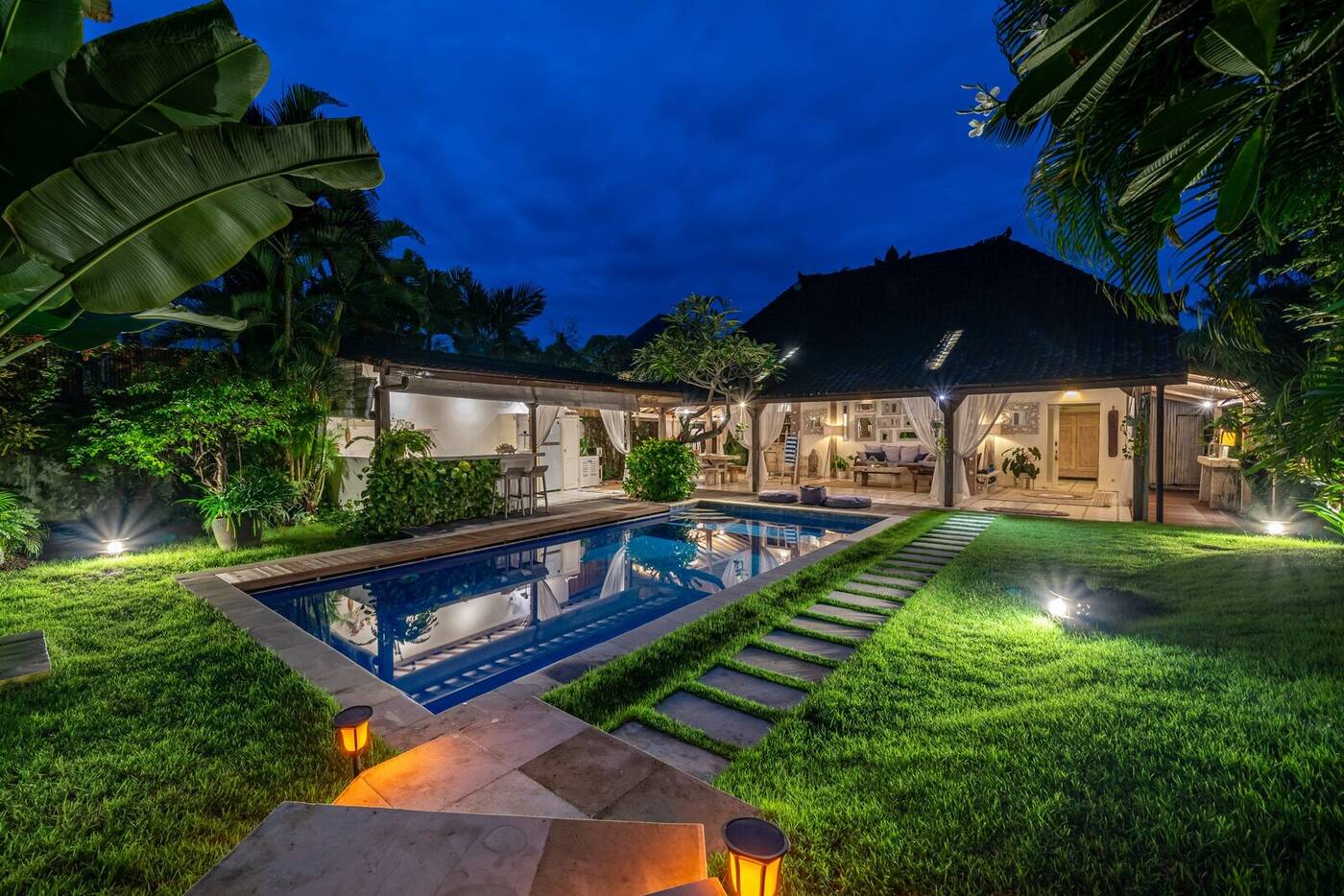 Garden and pool at night, private villa in Berawa, Bali